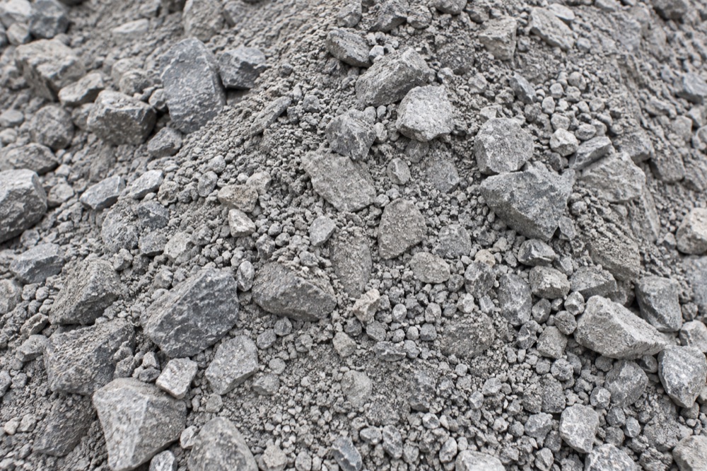 AI-generated illustration of crusher run: mixed angular crushed stone with fine stone dust